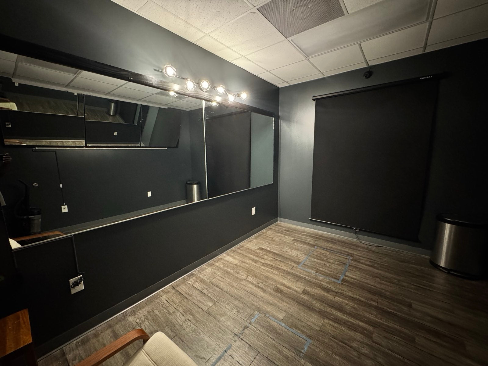 Professional posing room with full mirrors and lighting at Iconic Gym